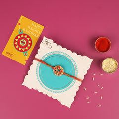 KESAR ROYAL PINK DRYFRUIT BOX WITH RED FLOWER RAKHI