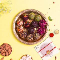 Assorted Gourmet 24 pcs Laddoos in a Tin Box With 2 Rakhis