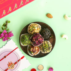 Artisanal Premium Assorted Laddoo 12 pcs in a Fancy Gift Box With 2 Rakhis
